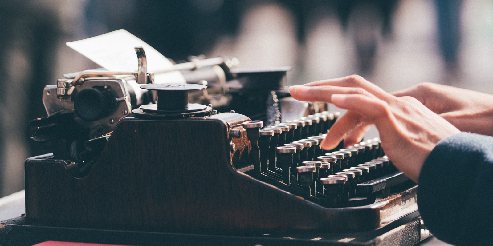 typing on typewriter 1600px fingers typing on typewriter